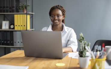 portrait-young-woman-working-her-laptop-startup-company