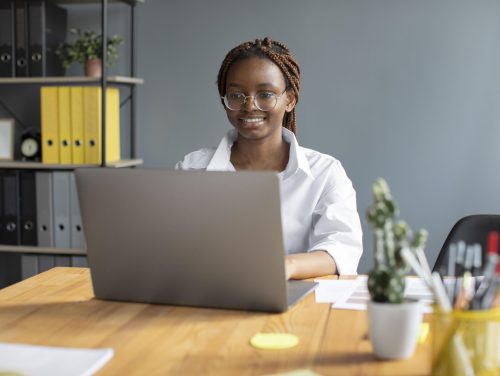 portrait-young-woman-working-her-laptop-startup-company